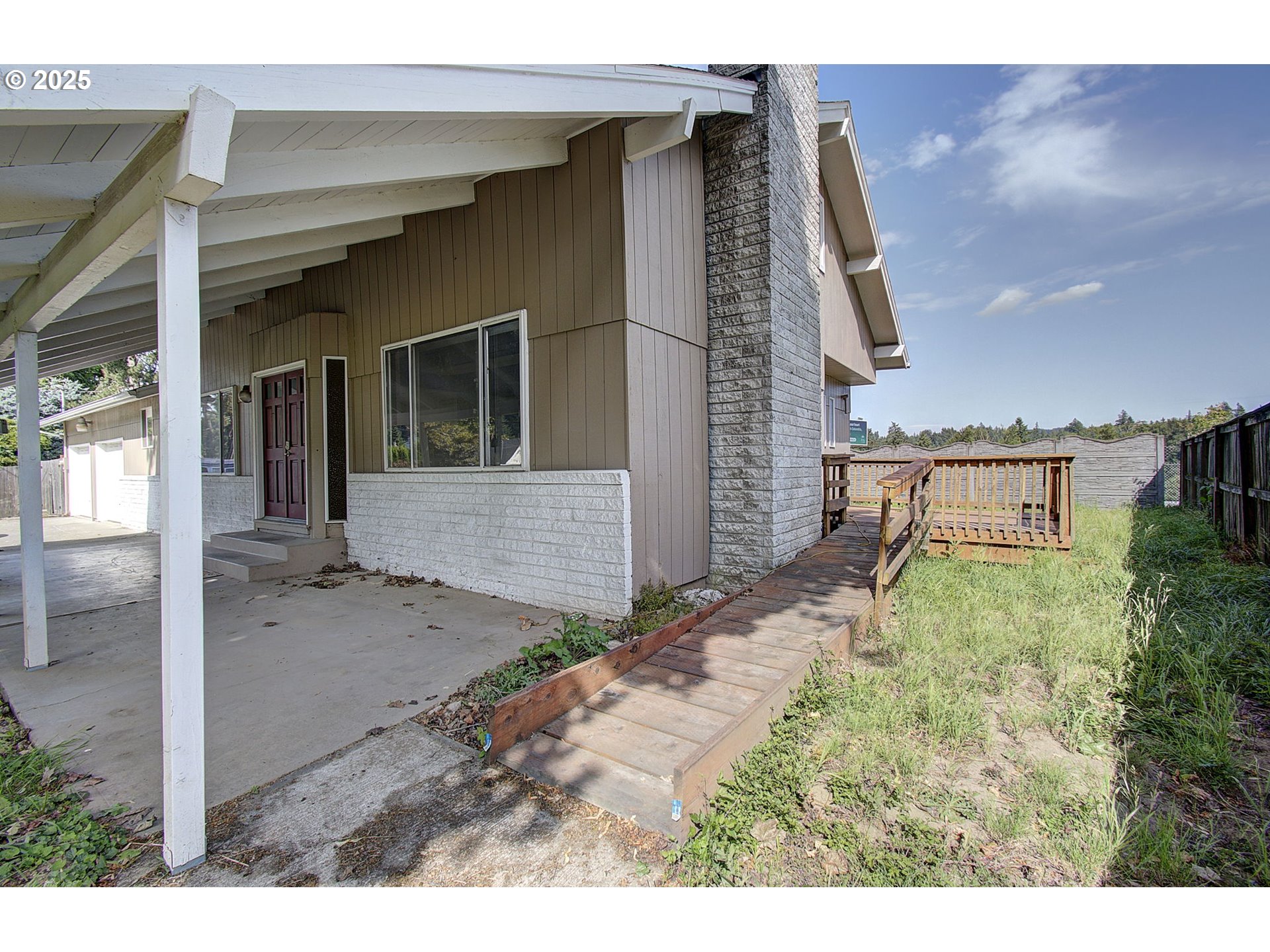 8400 Cason Road Gladstone, OR 97027 - Photo 3 of 35 a backyard of a house with large trees and barbeque oven
