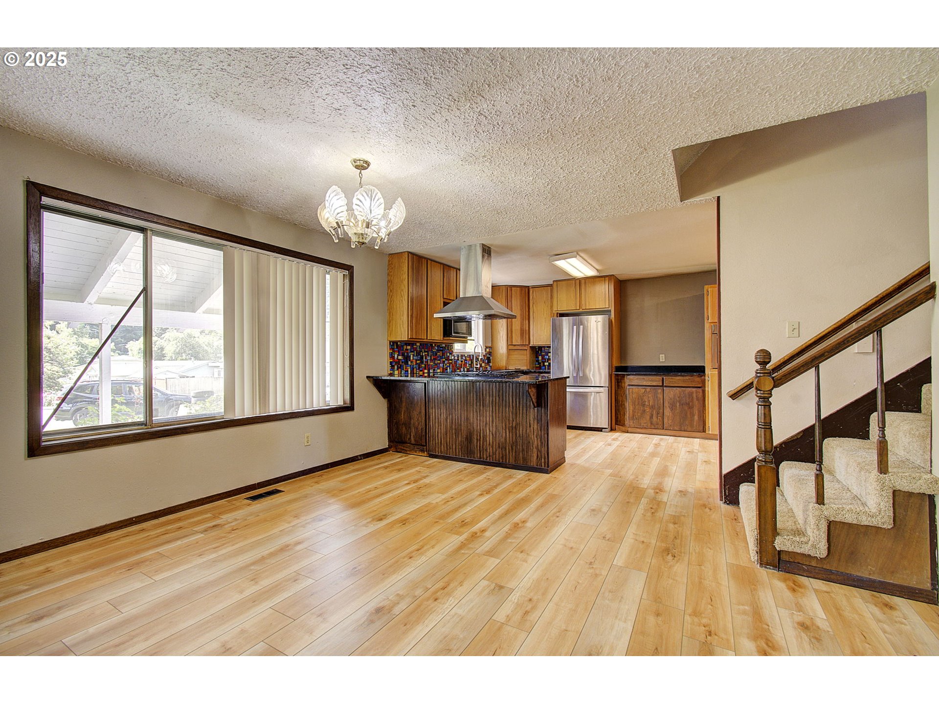 8400 Cason Road Gladstone, OR 97027 - Photo 4 of 35 a view of a kitchen with wooden floor and a window