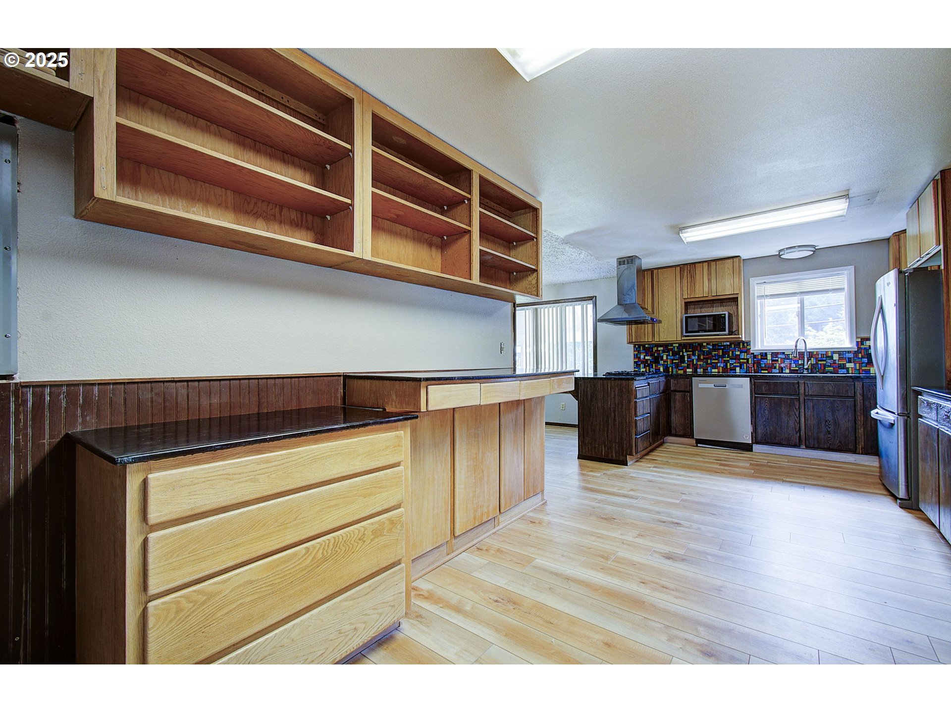 8400 Cason Road Gladstone, OR 97027 - Photo 7 of 35 a kitchen with stainless steel appliances granite countertop a stove and a sink