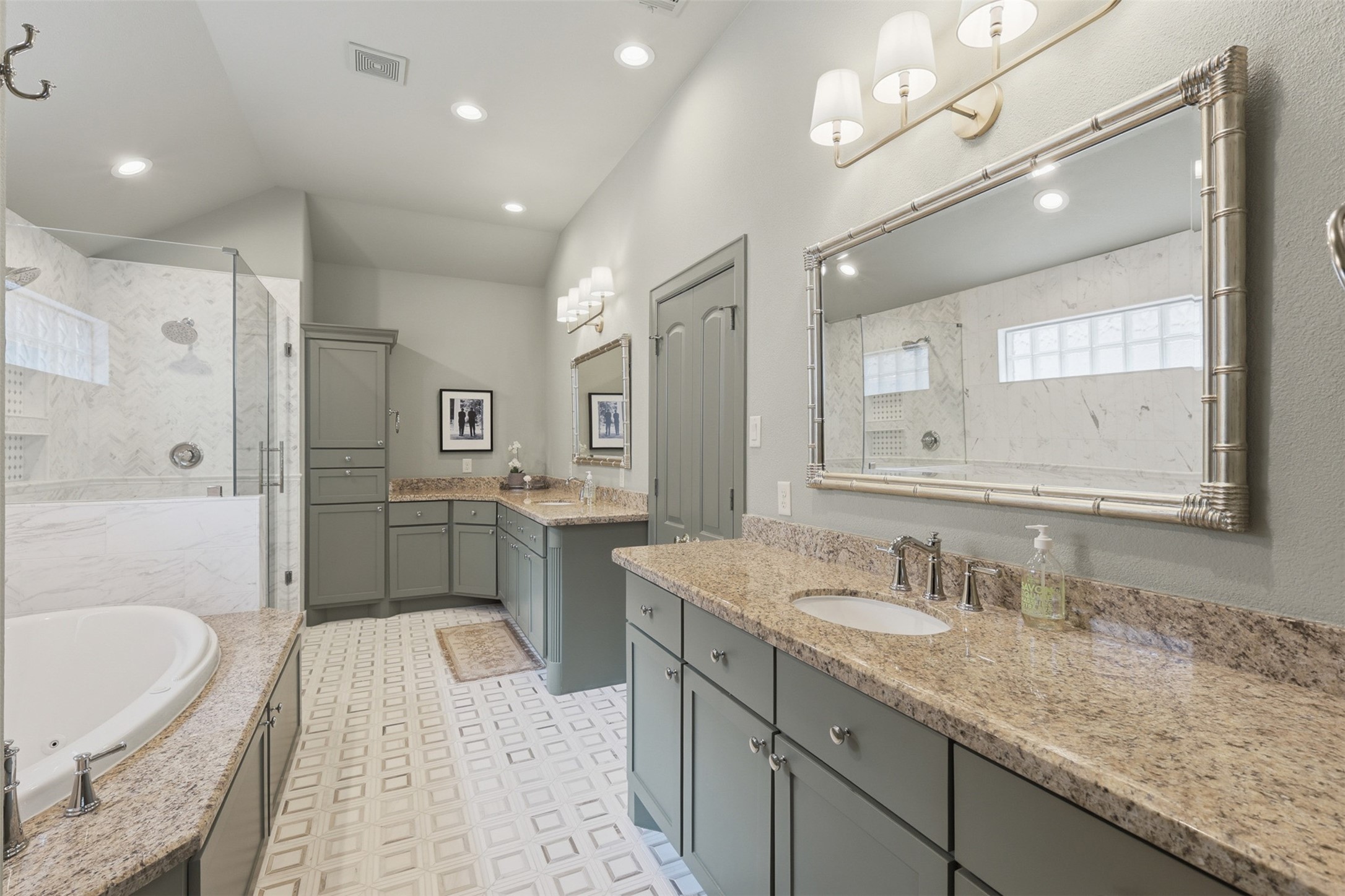 1956 Welch Street Houston, TX 77019 - Photo 18 of 29 Primary bathroom features double sinks, soaking tub, private water closet and double doors lead into oversized walk-in closet