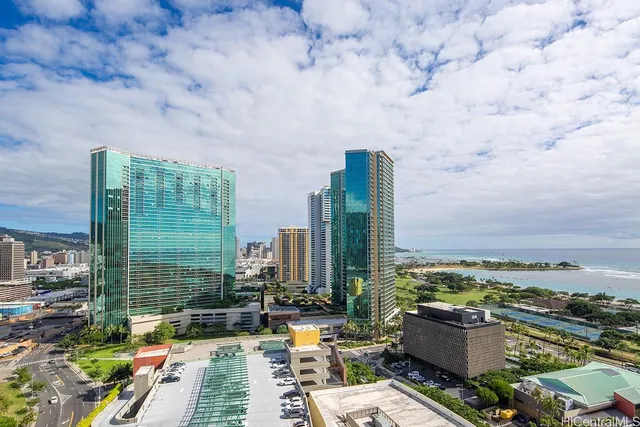 a view of terrace with lawn chairs and iron fence