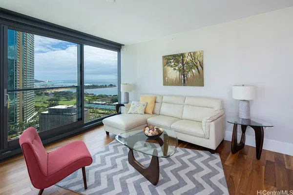 a living room with furniture and a large window