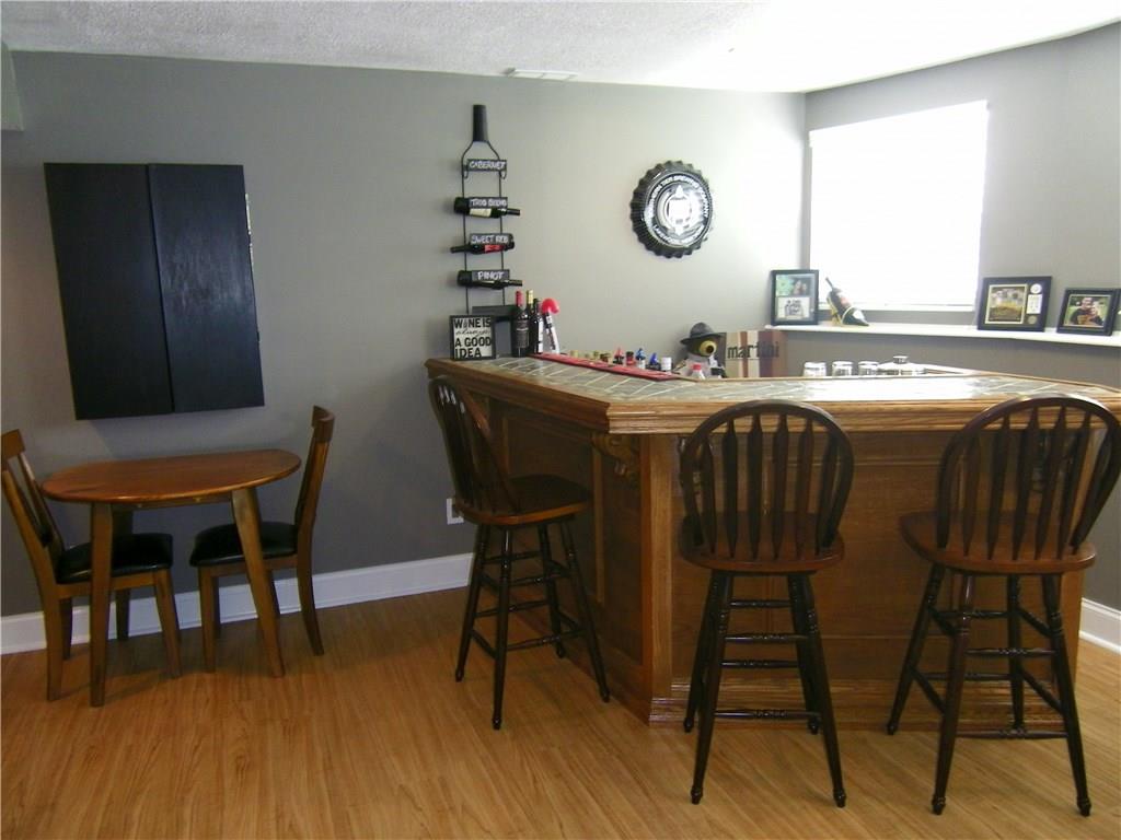 203 Commodore Drive McDonald, PA 15057 - Photo 19 of 24 Lower Level. Bar has slate top.