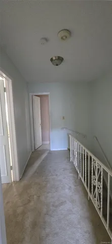 a view of a hallway with entryway