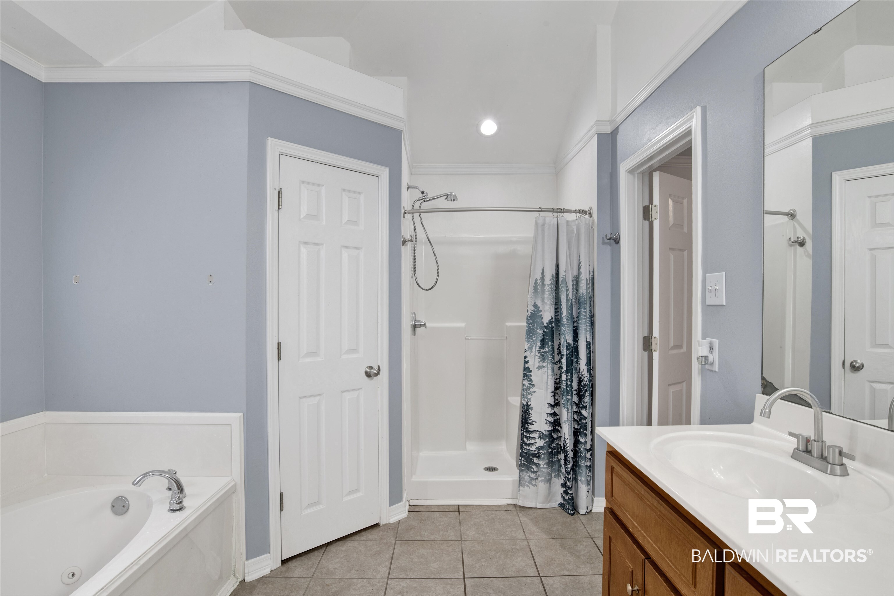 9534 Labrador Run North Mobile, AL 36695 - Photo 26 of 30 Full bathroom with light tile patterned floors, vanity, a stall shower, a whirlpool tub, and crown molding