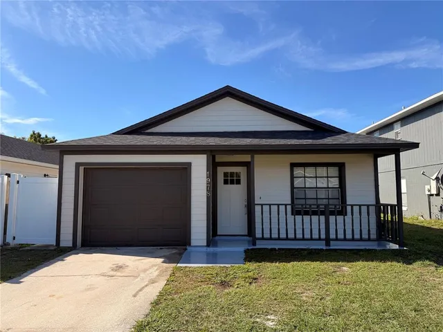 a front view of a house with yard and window