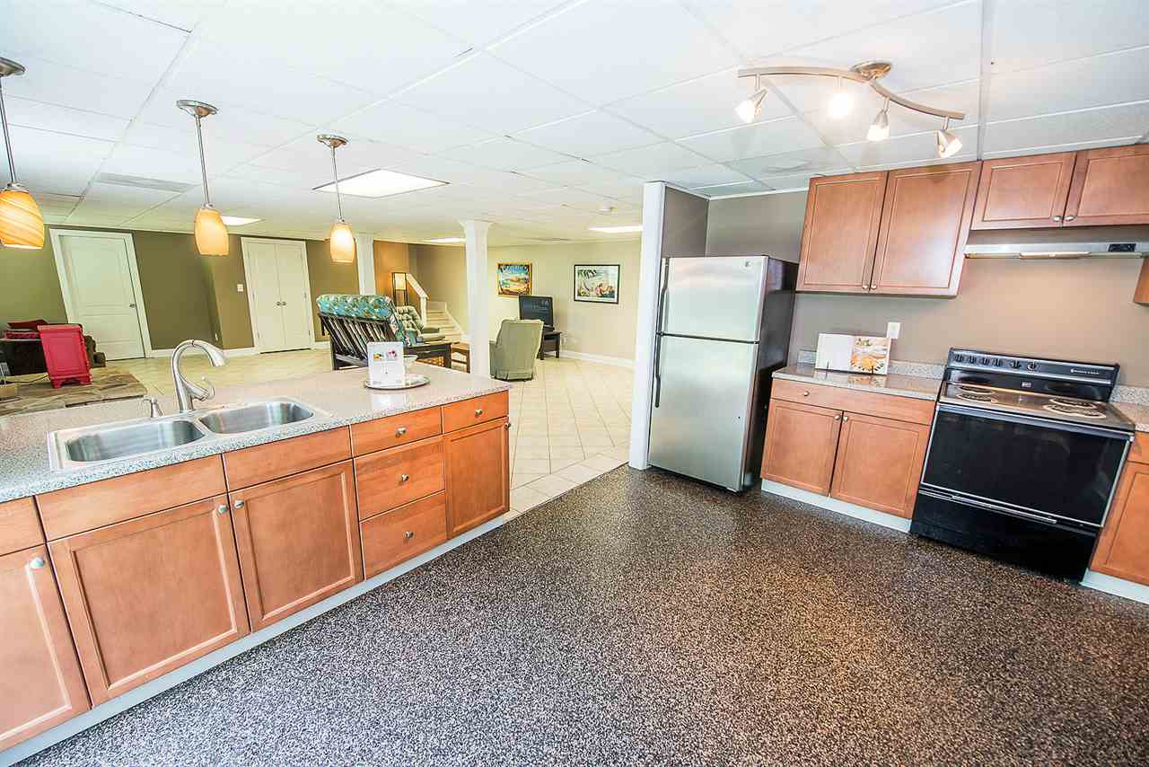6820 Lake Wheeler Road Raleigh, NC 27603 - Photo 13 of 25 A view of the basement den from the open kitchen.