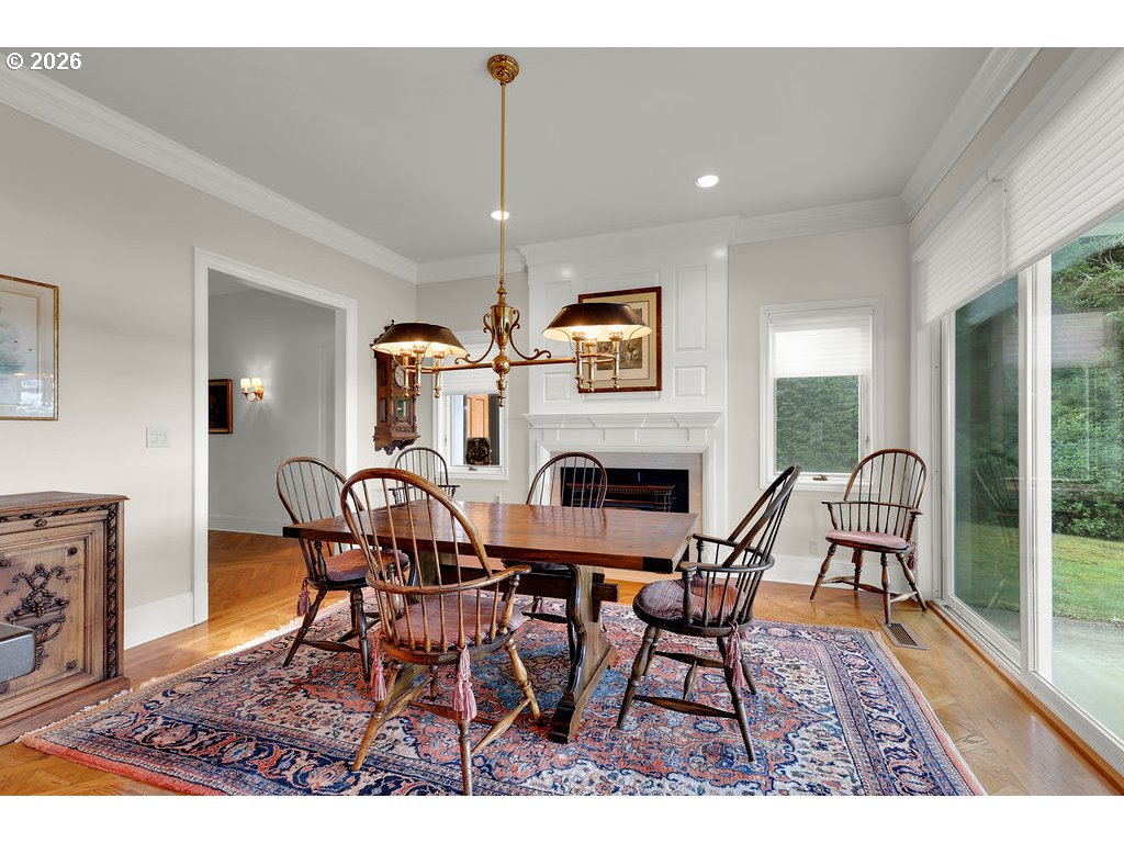 5255 Salal Court Florence, OR 97439 - Photo 12 of 46 a dining room with furniture a chandelier and wooden floor