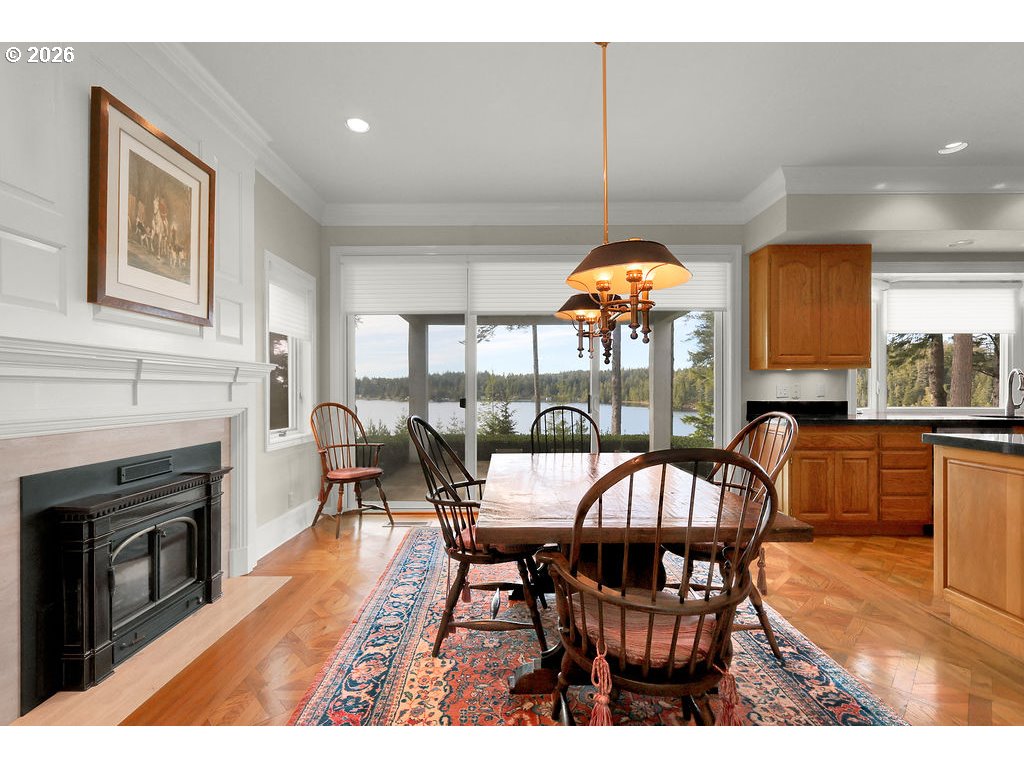 5255 Salal Court Florence, OR 97439 - Photo 13 of 46 a view of a dining room with furniture window and wooden floor