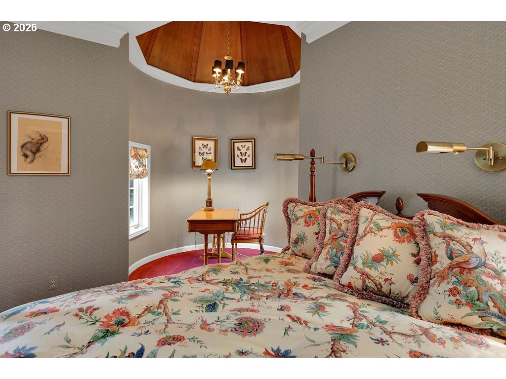 5255 Salal Court Florence, OR 97439 - Photo 34 of 46 a bedroom with a bed and a workspace