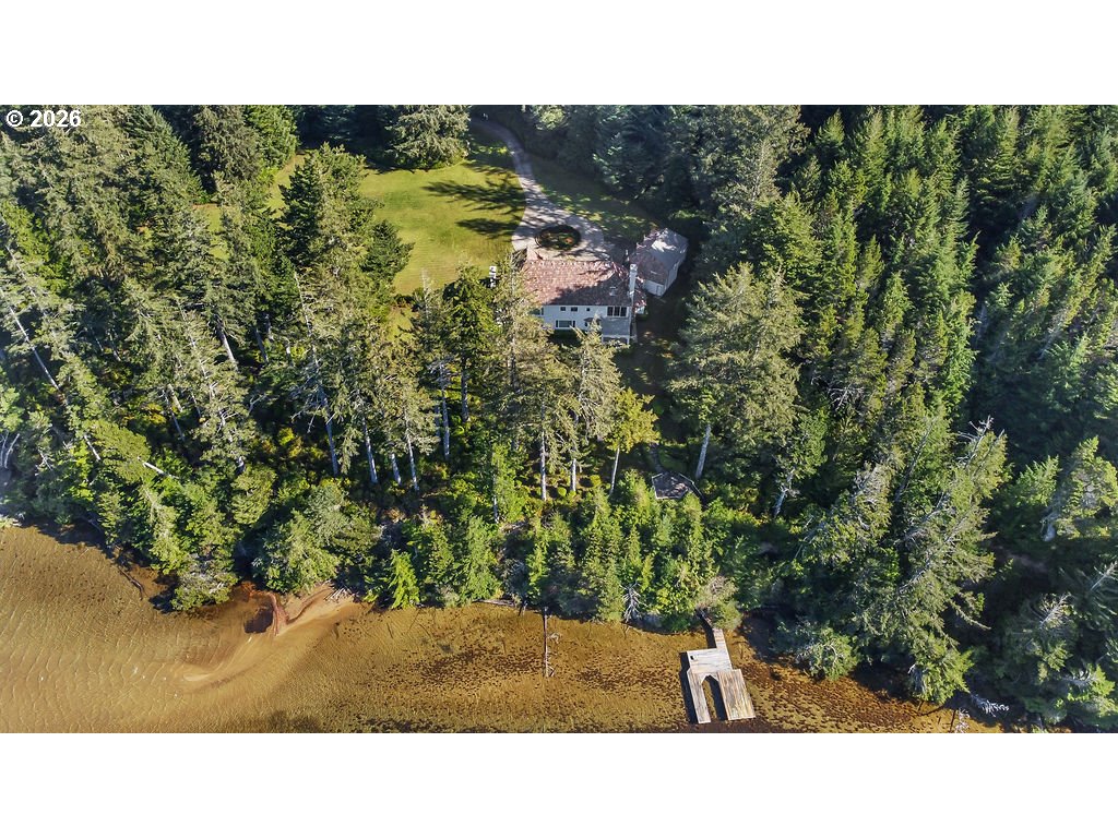 5255 Salal Court Florence, OR 97439 - Photo 44 of 46 a open area with trees in the background