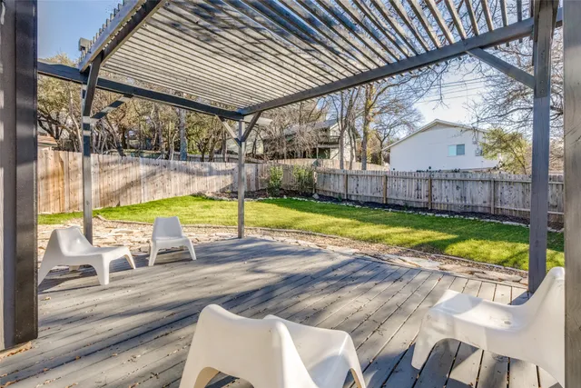 a view of a swimming pool with a patio