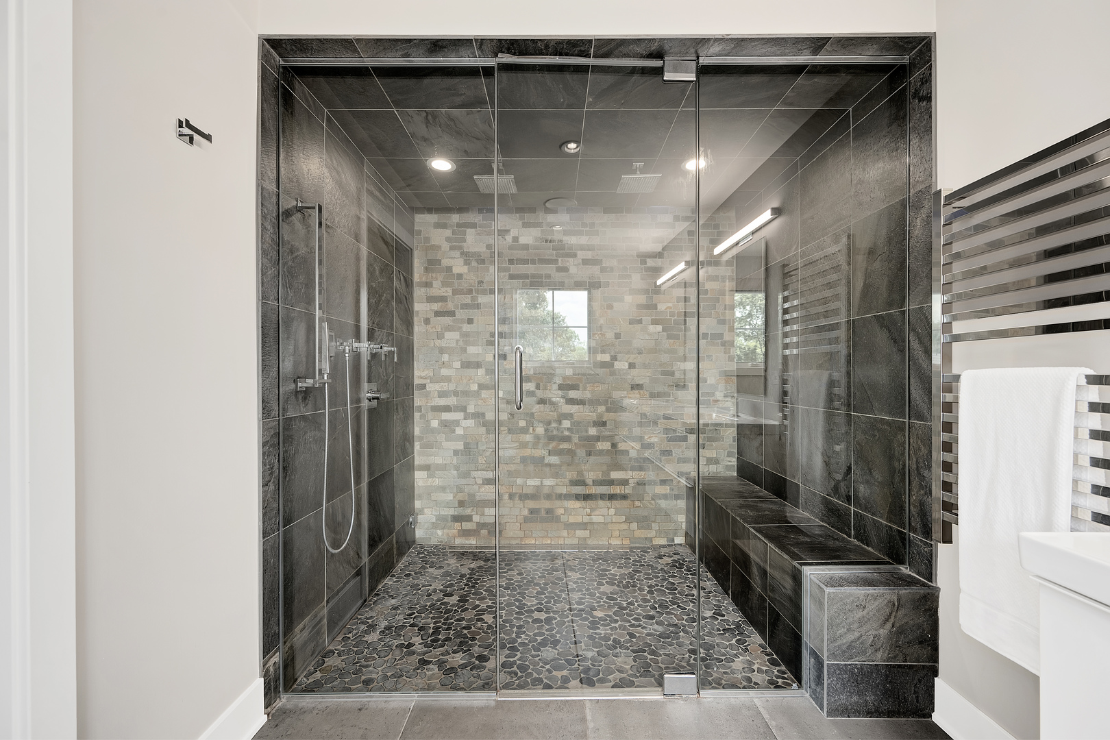 4333 Roslyn Road Downers Grove, IL 60515 - Photo 28 of 67 a bathroom with a glass shower door