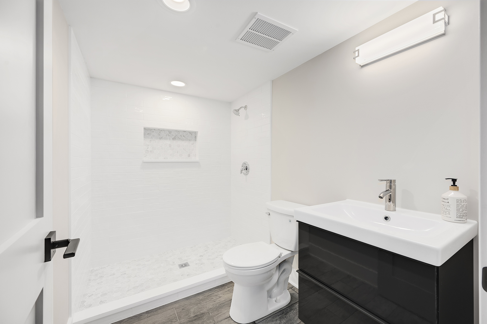 4333 Roslyn Road Downers Grove, IL 60515 - Photo 45 of 67 a bathroom with a sink toilet and vanity