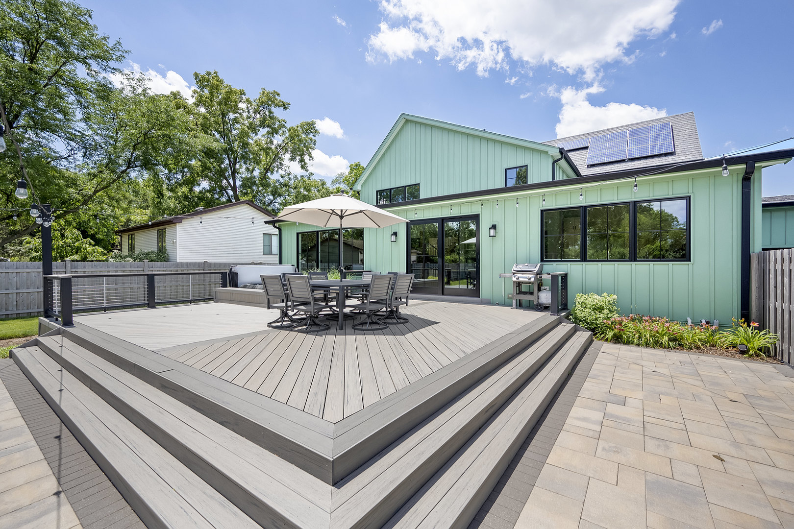 4333 Roslyn Road Downers Grove, IL 60515 - Photo 49 of 67 a view of a patio with table and chairs potted plants with wooden floor and fence
