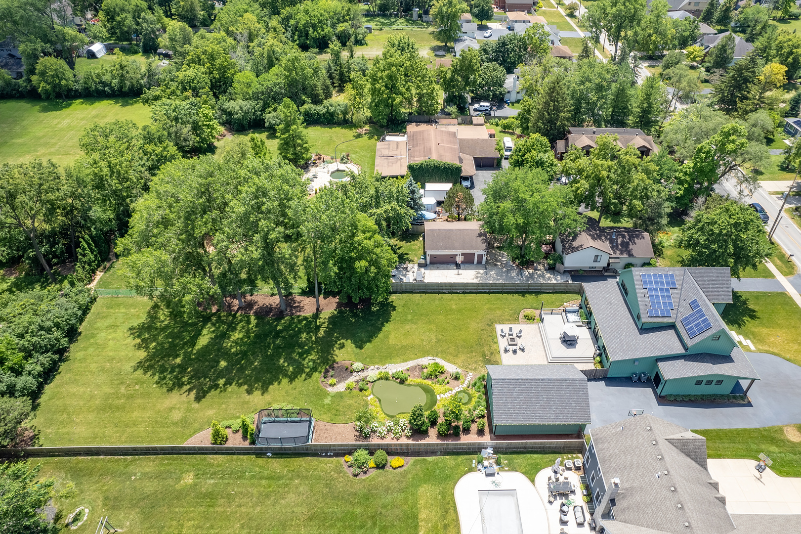 4333 Roslyn Road Downers Grove, IL 60515 - Photo 52 of 67 an aerial view of a house with swimming pool lawn chairs and a yard