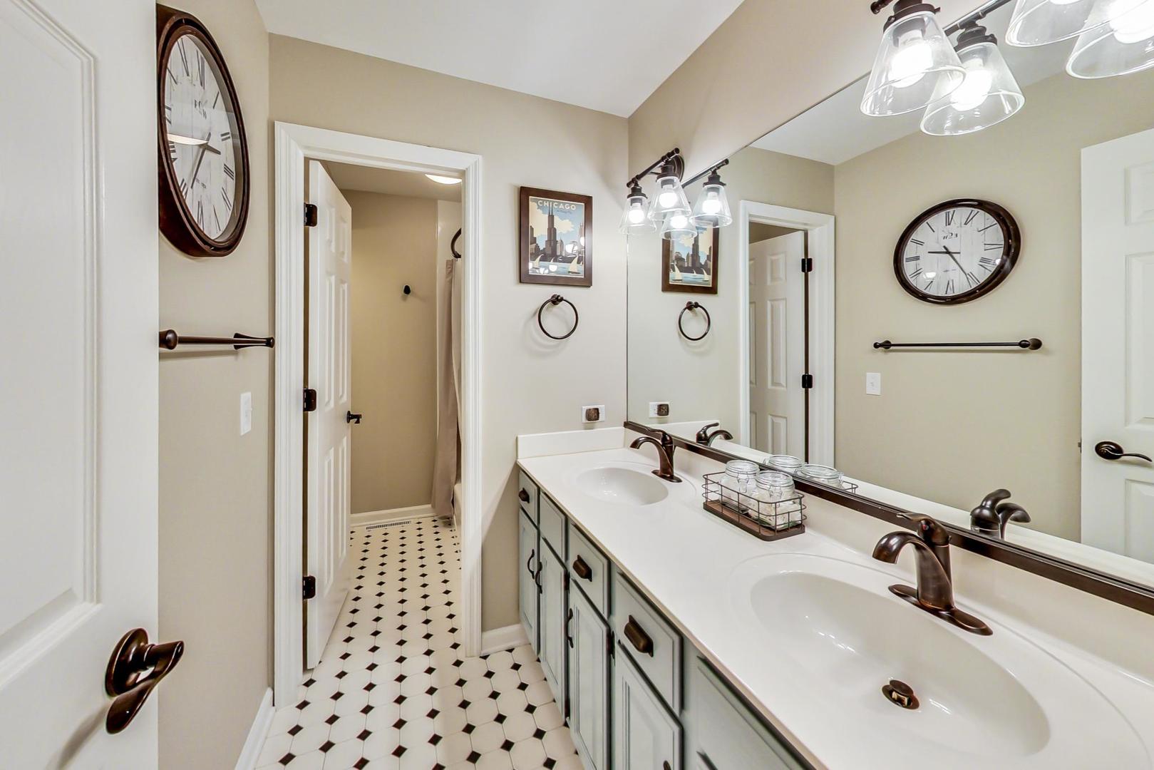5258 Hilltop Road Long Grove, IL 60047 - Photo 30 of 50 a bathroom with a sink and a mirror