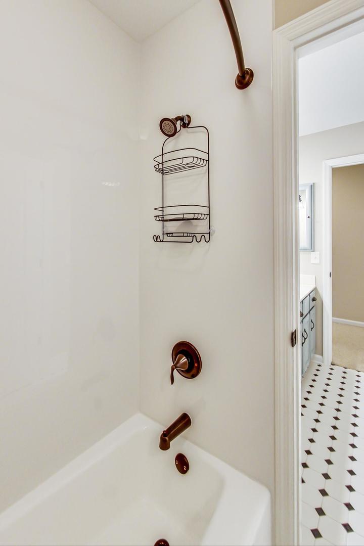 5258 Hilltop Road Long Grove, IL 60047 - Photo 31 of 50 a bathroom with a sink and a mirror