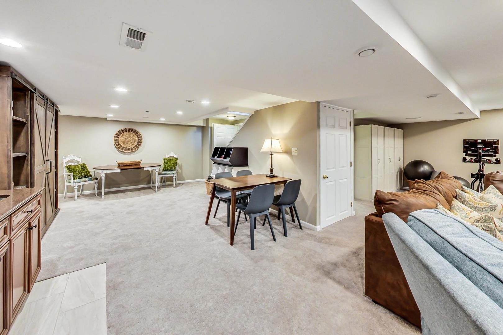 5258 Hilltop Road Long Grove, IL 60047 - Photo 33 of 50 a living room with furniture and a flat screen tv
