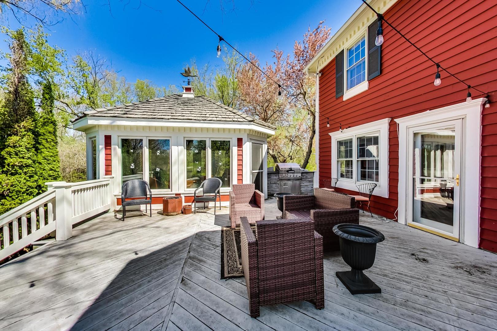5258 Hilltop Road Long Grove, IL 60047 - Photo 38 of 50 a view of a patio with couches chairs and wooden floor