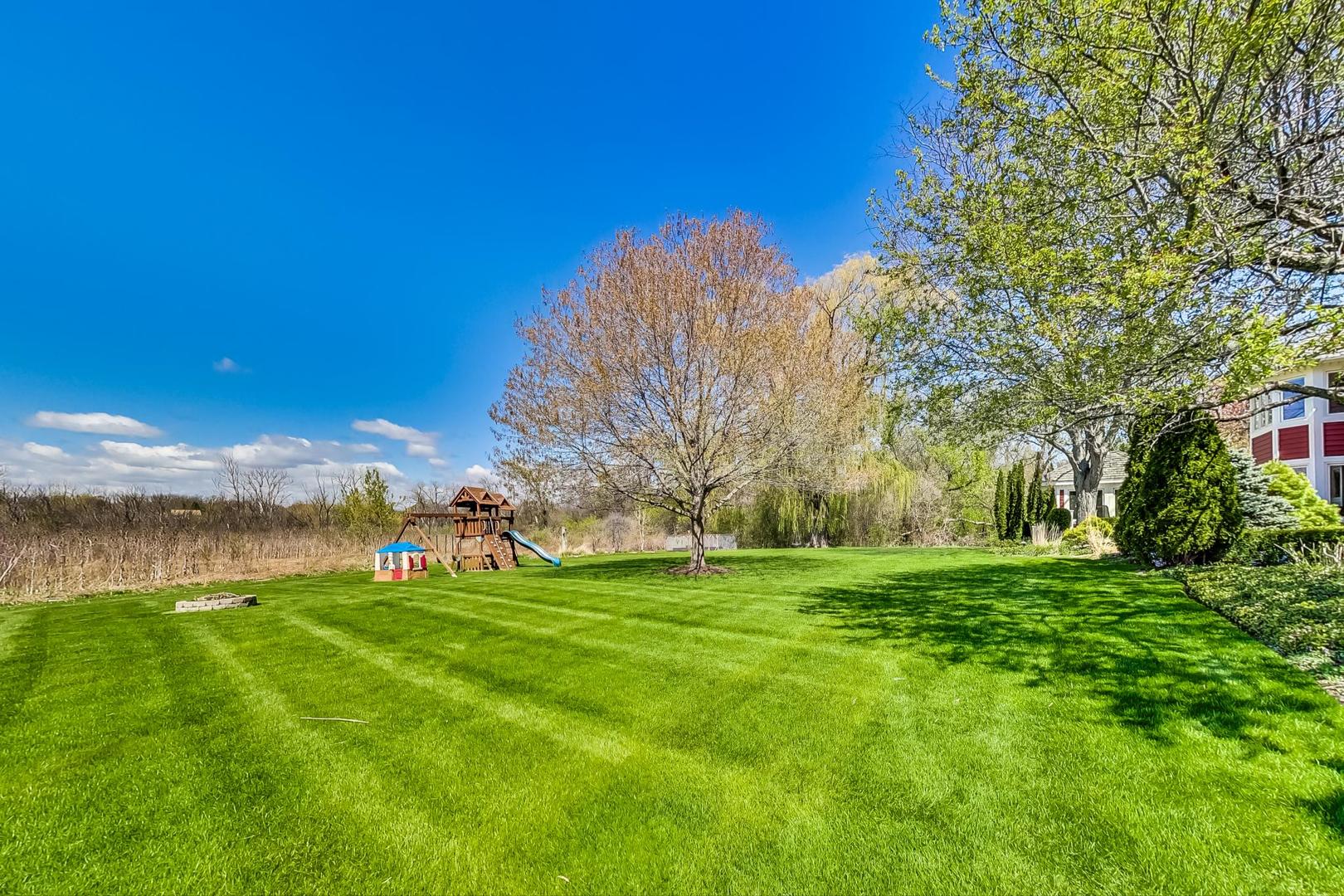 5258 Hilltop Road Long Grove, IL 60047 - Photo 44 of 50 a view of a field with grass and trees