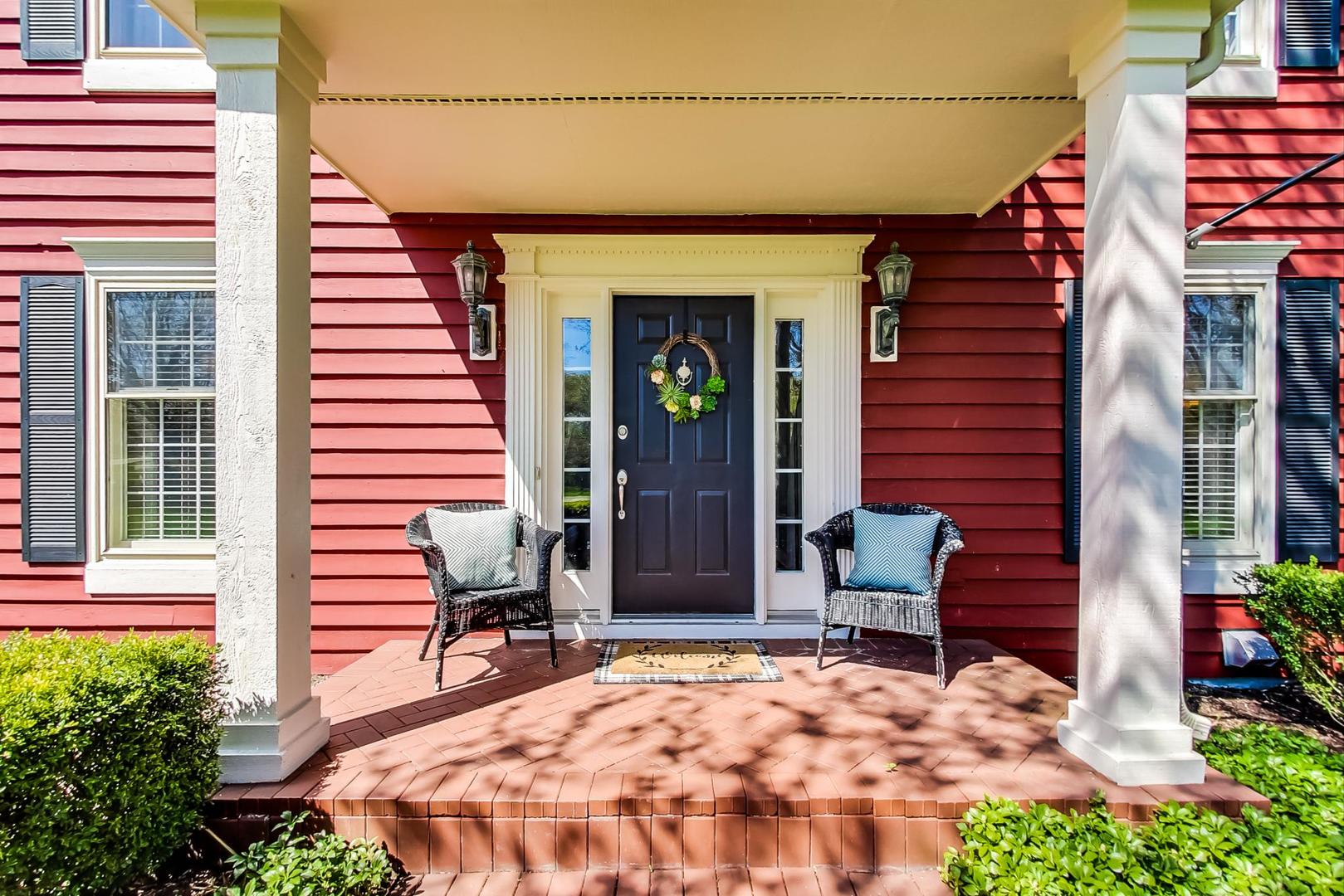 5258 Hilltop Road Long Grove, IL 60047 - Photo 5 of 50 a view of a chairs and table in the backyard