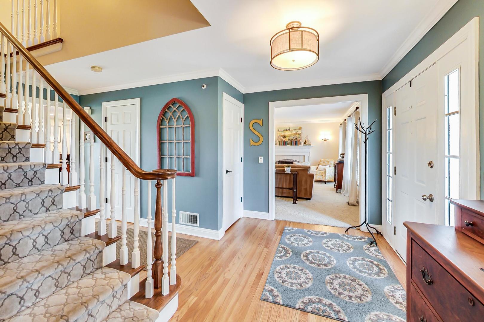 5258 Hilltop Road Long Grove, IL 60047 - Photo 6 of 50 a bedroom with furniture and a wooden floor