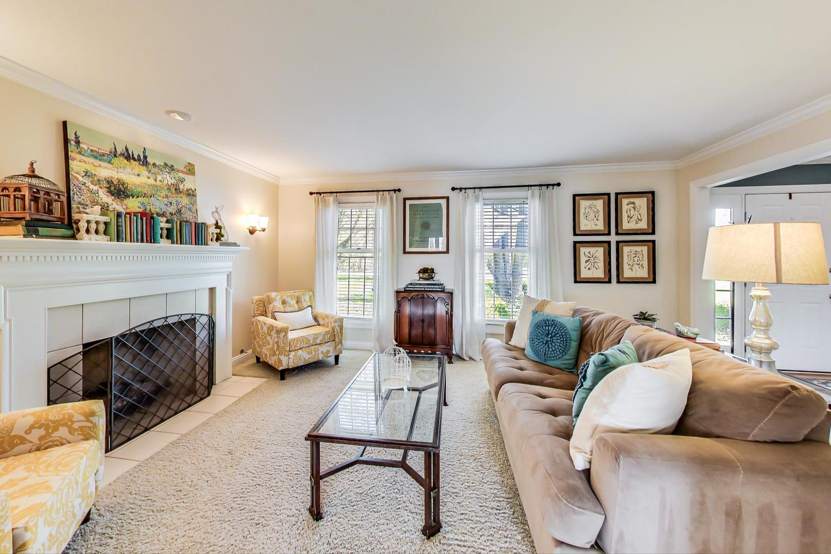 5258 Hilltop Road Long Grove, IL 60047 - Photo 8 of 50 a living room with furniture fireplace and a large window