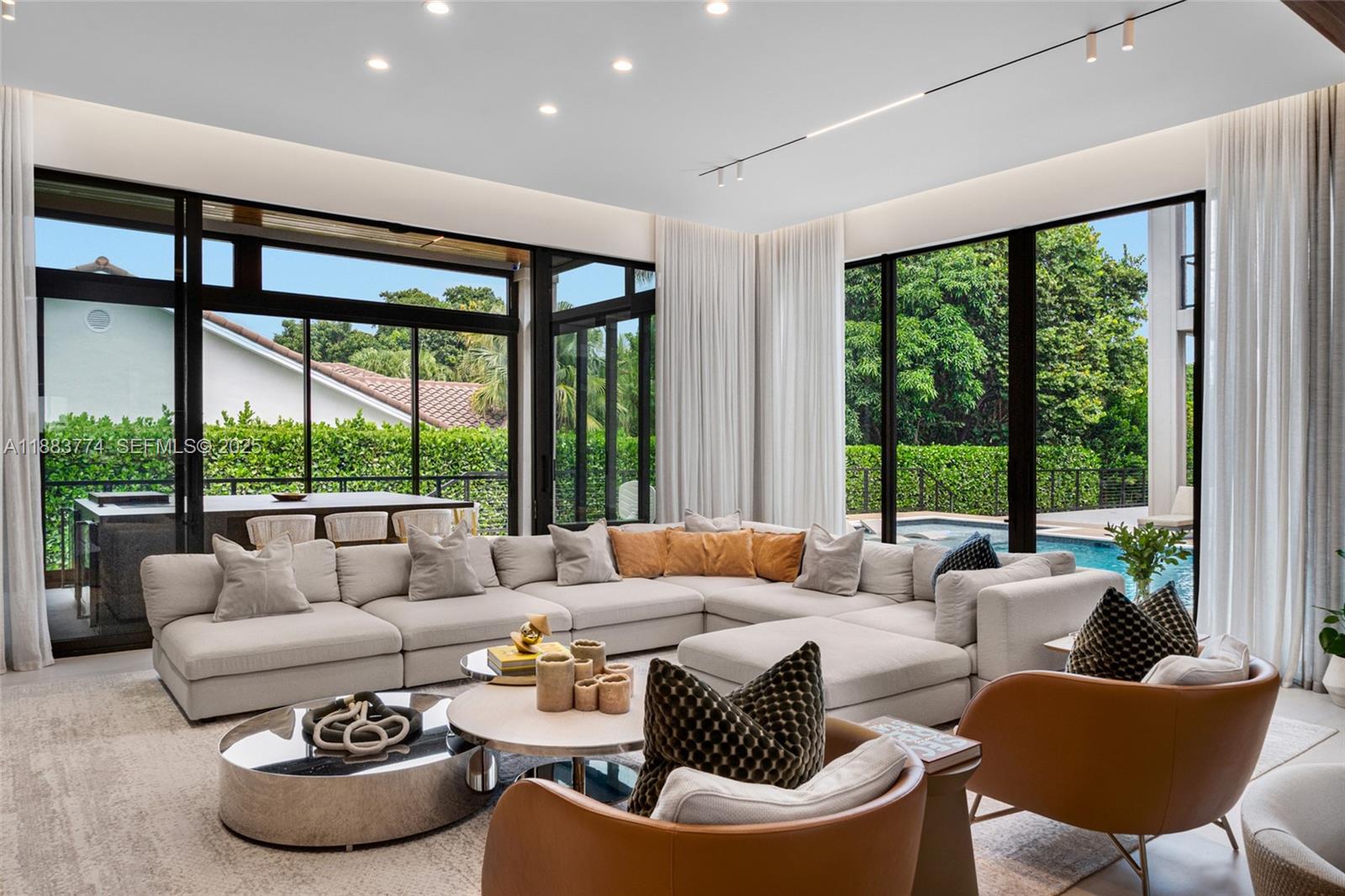 13120 Old Cutler Road Pinecrest, FL 33156 - Photo 14 of 58 a living room with furniture and a large window