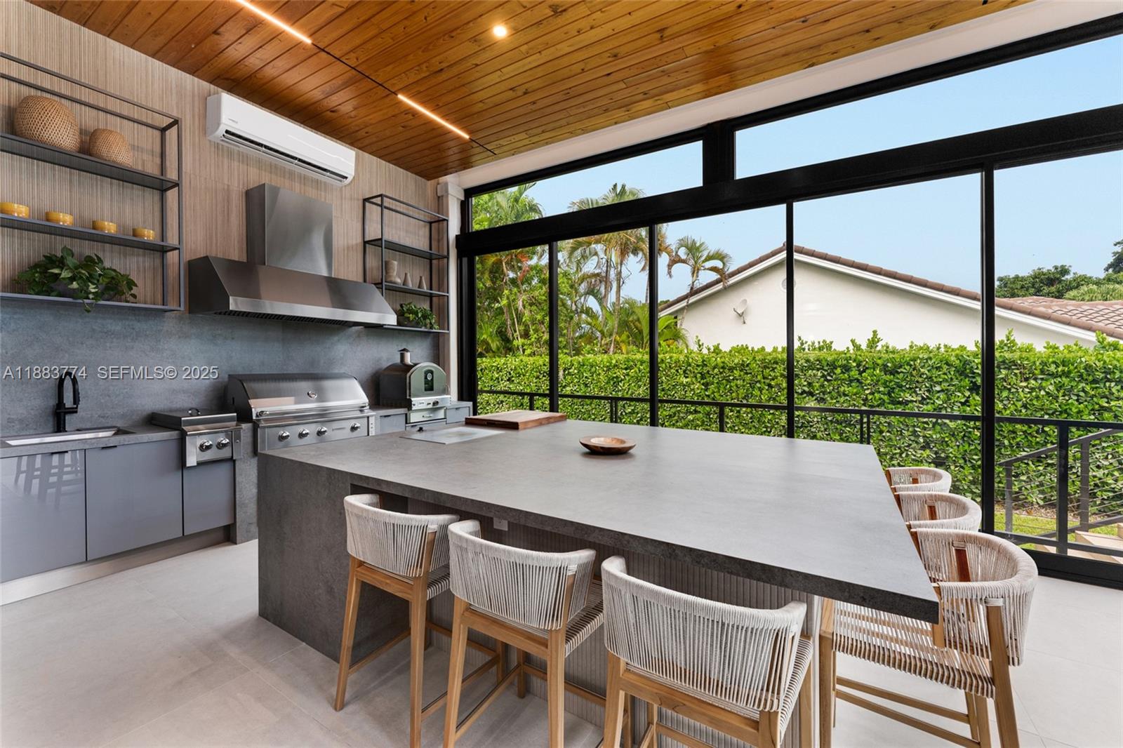 13120 Old Cutler Road Pinecrest, FL 33156 - Photo 15 of 58 a kitchen with a stove a sink and a table