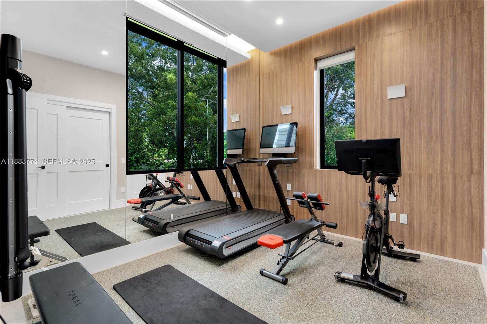 13120 Old Cutler Road Pinecrest, FL 33156 - Photo 18 of 58 a view of a workspace with gym equipment