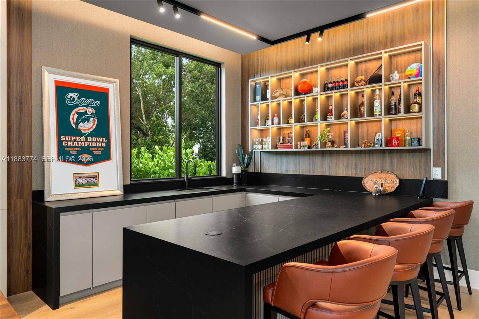 13120 Old Cutler Road Pinecrest, FL 33156 - Photo 21 of 56 a kitchen with a table and chairs in it