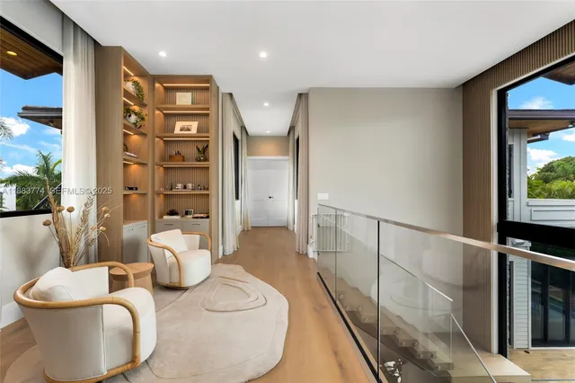 a bedroom with a bed and large window