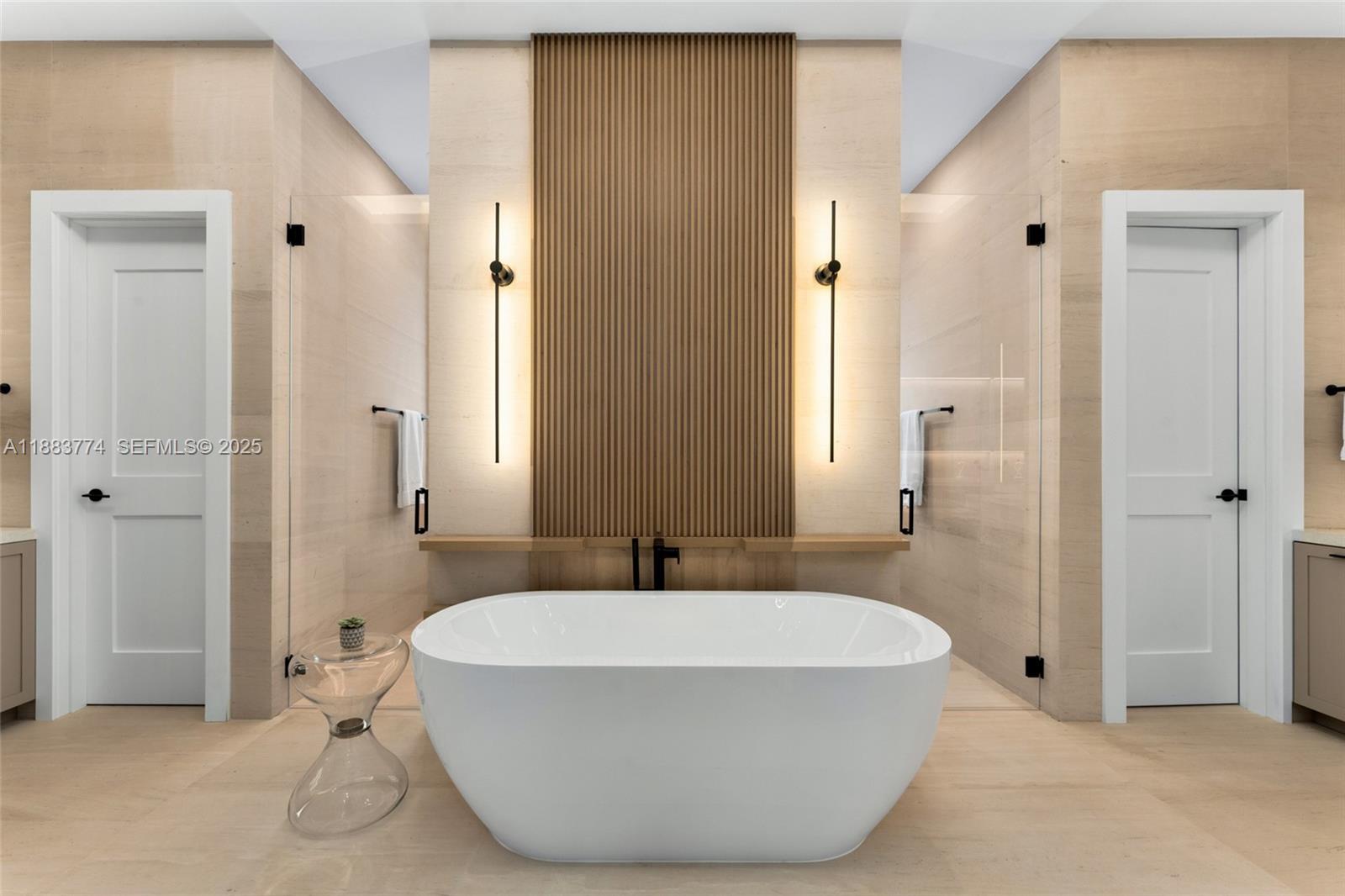 13120 Old Cutler Road Pinecrest, FL 33156 - Photo 29 of 58 a bathroom with a bathtub and a sink