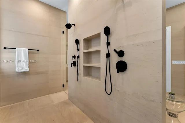 a bedroom with a bed and glass window