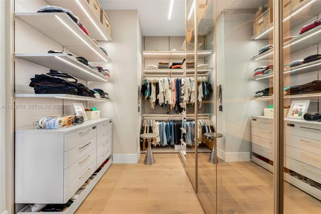 a bedroom with a bed and glass door