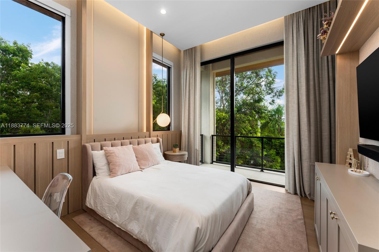 13120 Old Cutler Road Pinecrest, FL 33156 - Photo 36 of 58 a bedroom with a bed and glass door