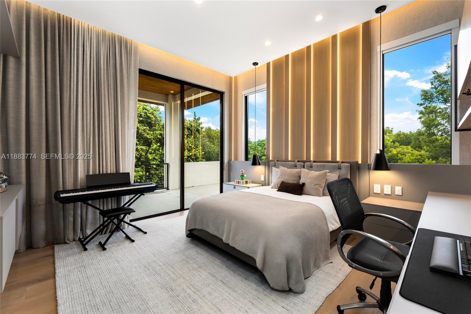 13120 Old Cutler Road Pinecrest, FL 33156 - Photo 38 of 58 a bedroom with a bed and a large window