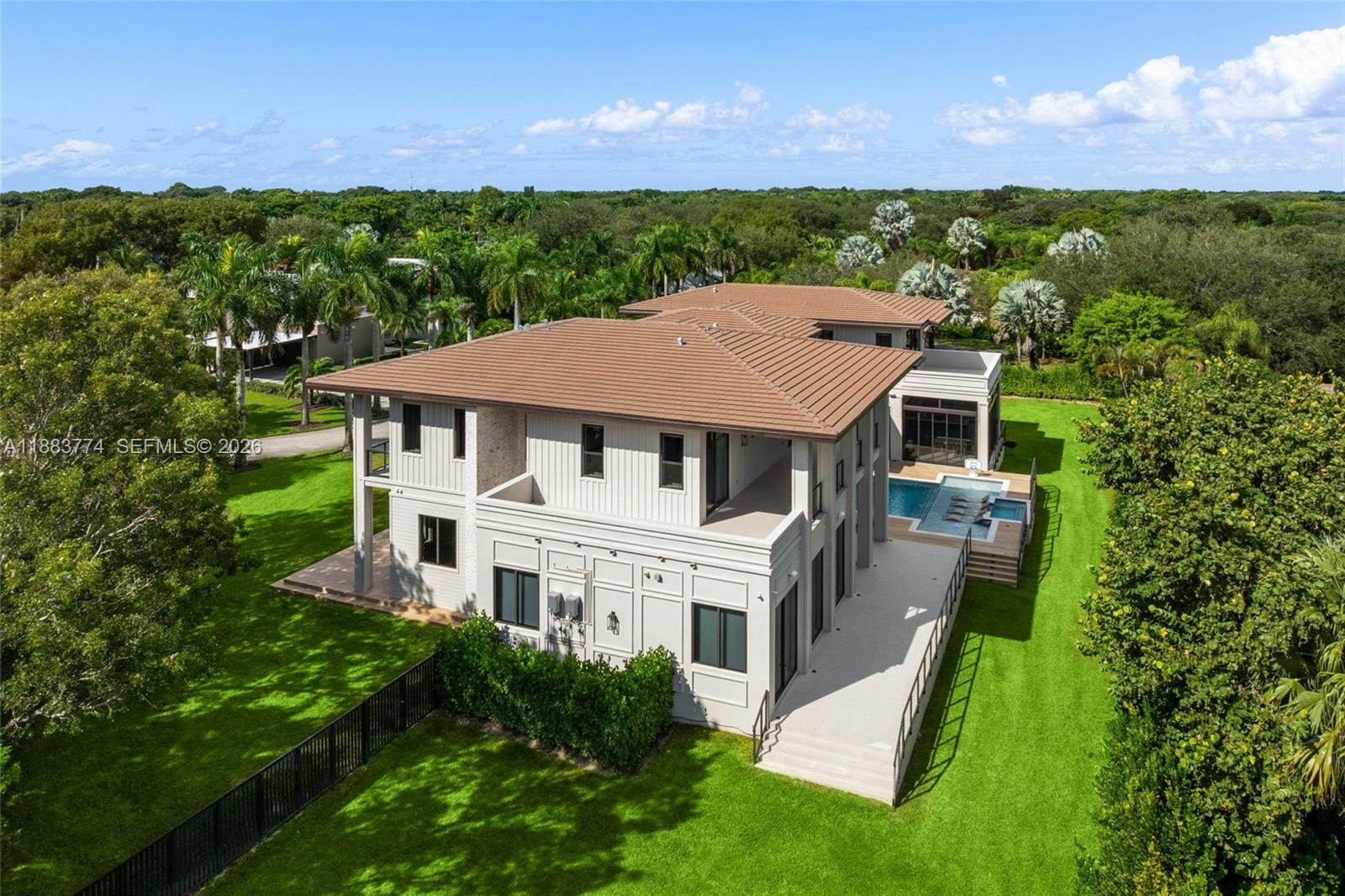 13120 Old Cutler Road Pinecrest, FL 33156 - Photo 48 of 56 a aerial view of a house with a big yard