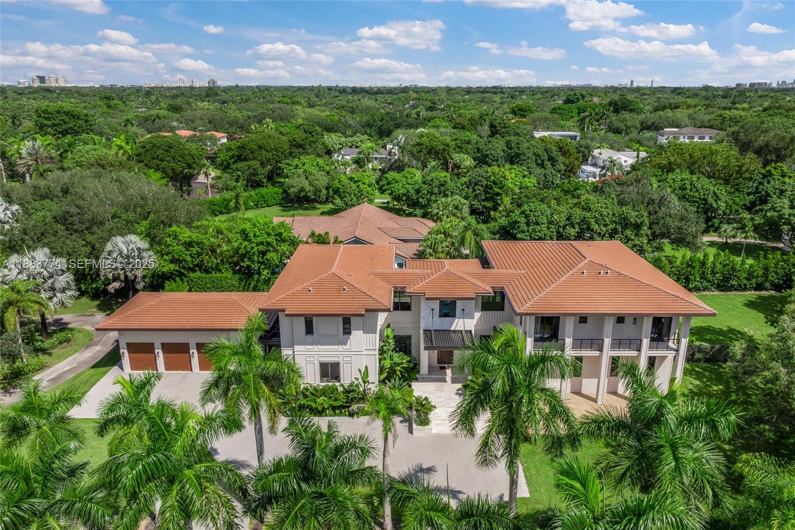 13120 Old Cutler Road Pinecrest, FL 33156 - Photo 49 of 58 an aerial view of house with yard and outdoor seating