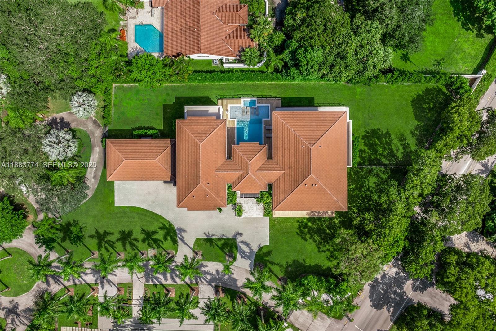 13120 Old Cutler Road Pinecrest, FL 33156 - Photo 50 of 58 an aerial view of a house with outdoor space and street view