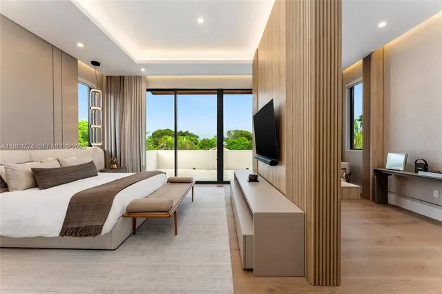 a aerial view of a house with a yard table and chairs