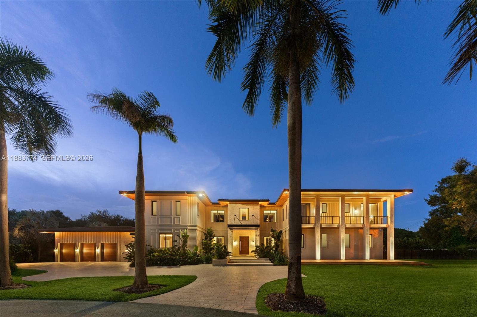 13120 Old Cutler Road Pinecrest, FL 33156 - Photo 51 of 56 a view of a house with a yard and palm tree