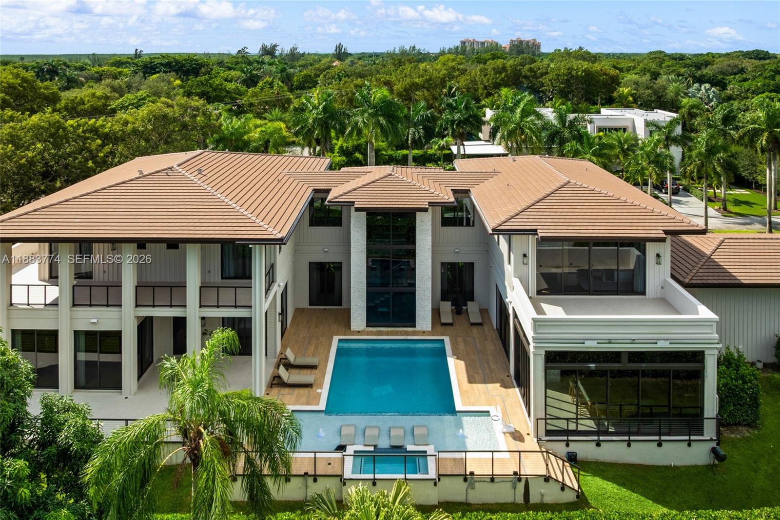 13120 Old Cutler Road Pinecrest, FL 33156 - Photo 6 of 56 a aerial view of a house with a yard table and chairs