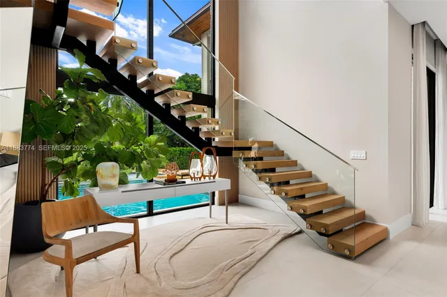 a large kitchen with a table and chairs in it