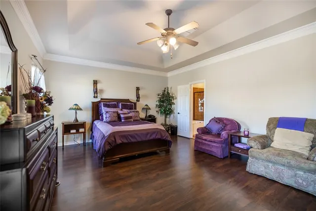 a bed room with furniture and a chandelier