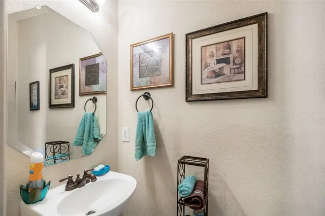 a bathroom with sink and mirror