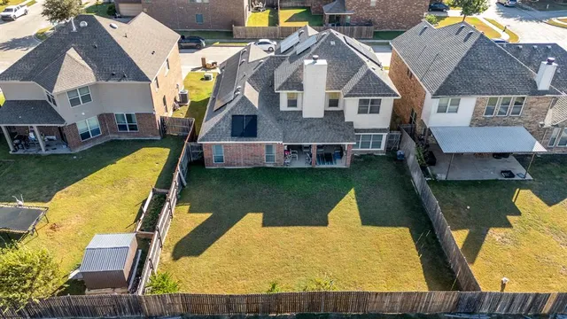 an aerial view of a house with swimming pool