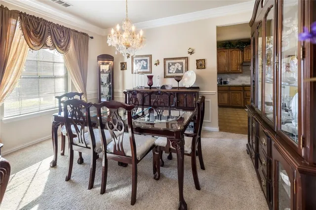 a view of a dining room with furniture window and outside view