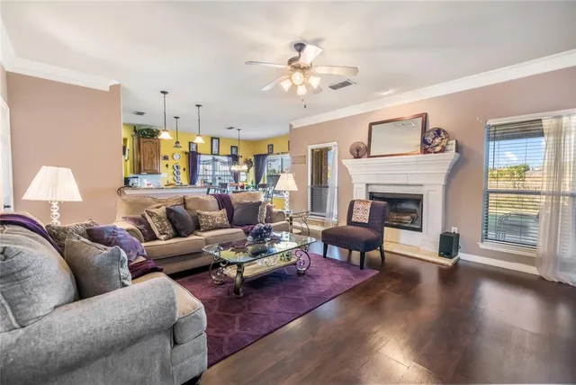 a living room with furniture and a fireplace